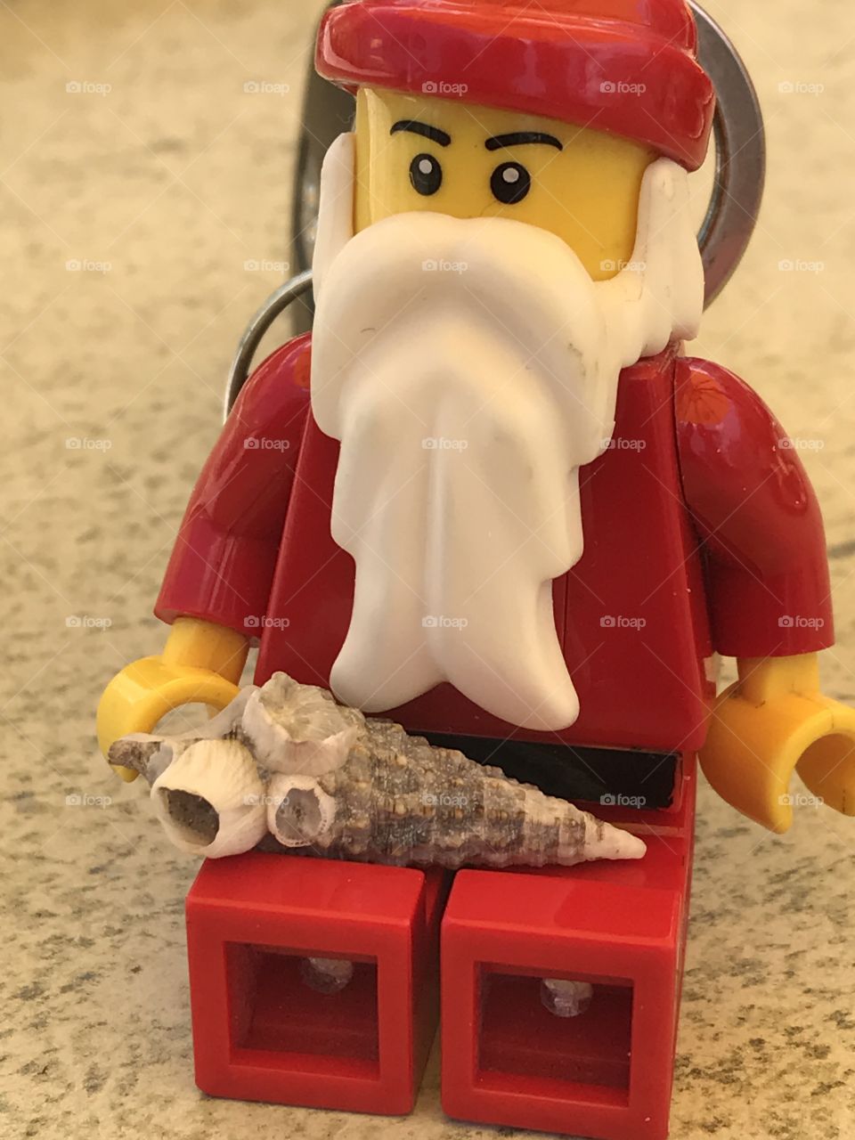 Lego and shell on the beach