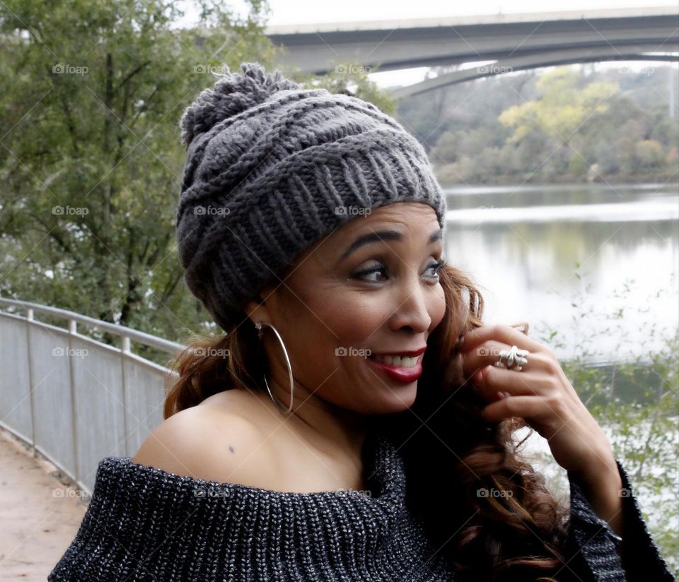 woman looking out over the water with a surprise look on her face