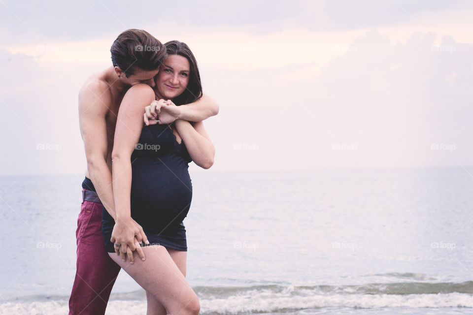 Portrait of cute couple near seaside