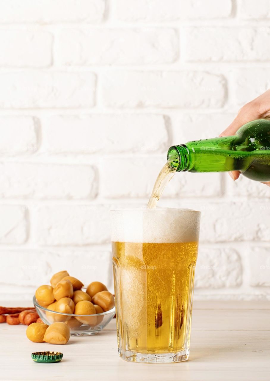 pouring beer from the bottle