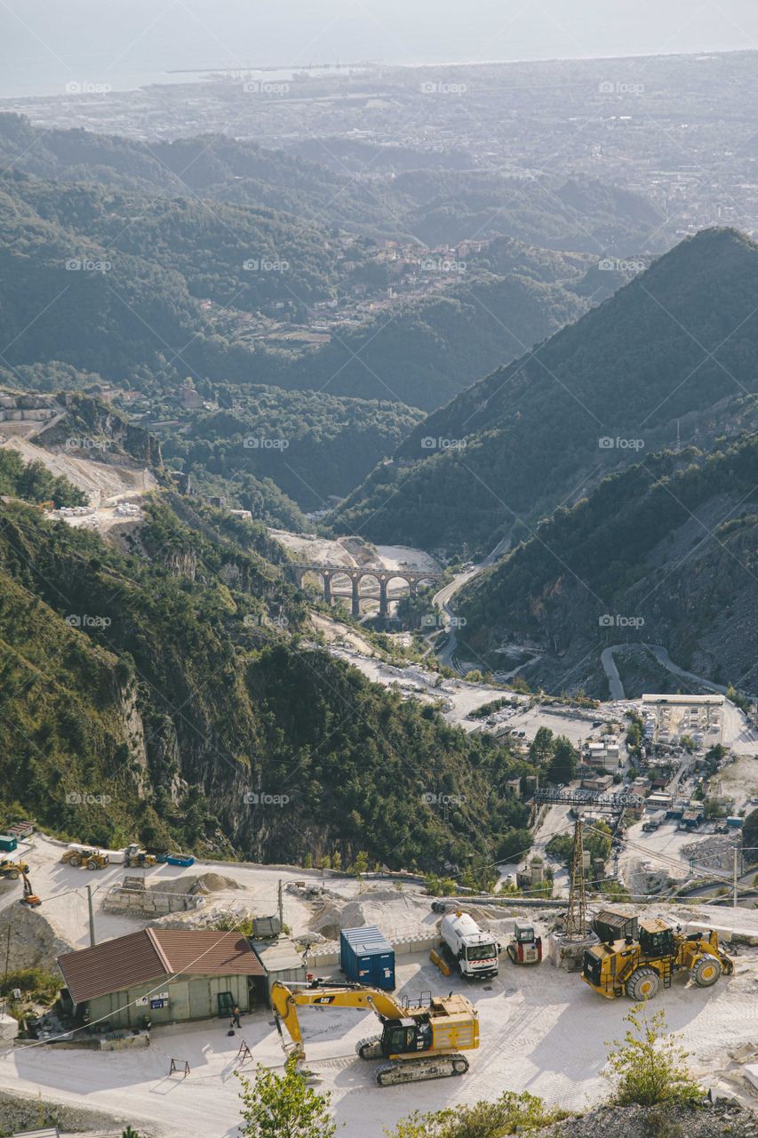 An Aerial View Of Construction In A Mountain Range