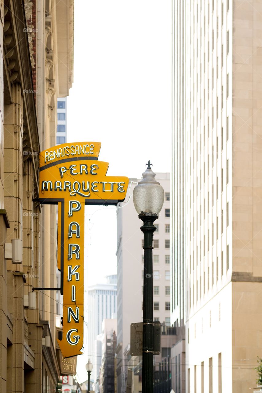 Yellow vintage sign on building in city street