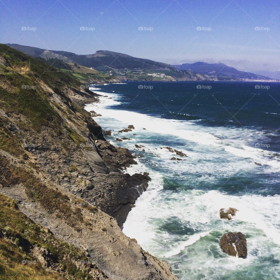 Scenic view of a sea against blue sky
