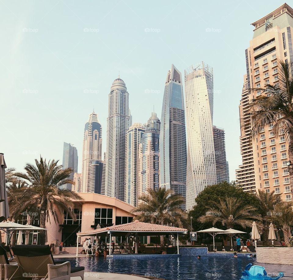 Dubai sky scrapers United Arabic Emirates and swimming pool