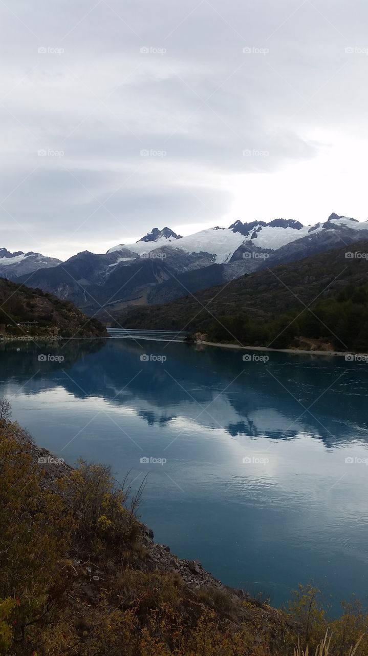 Reflection of mountain in idyllic lake