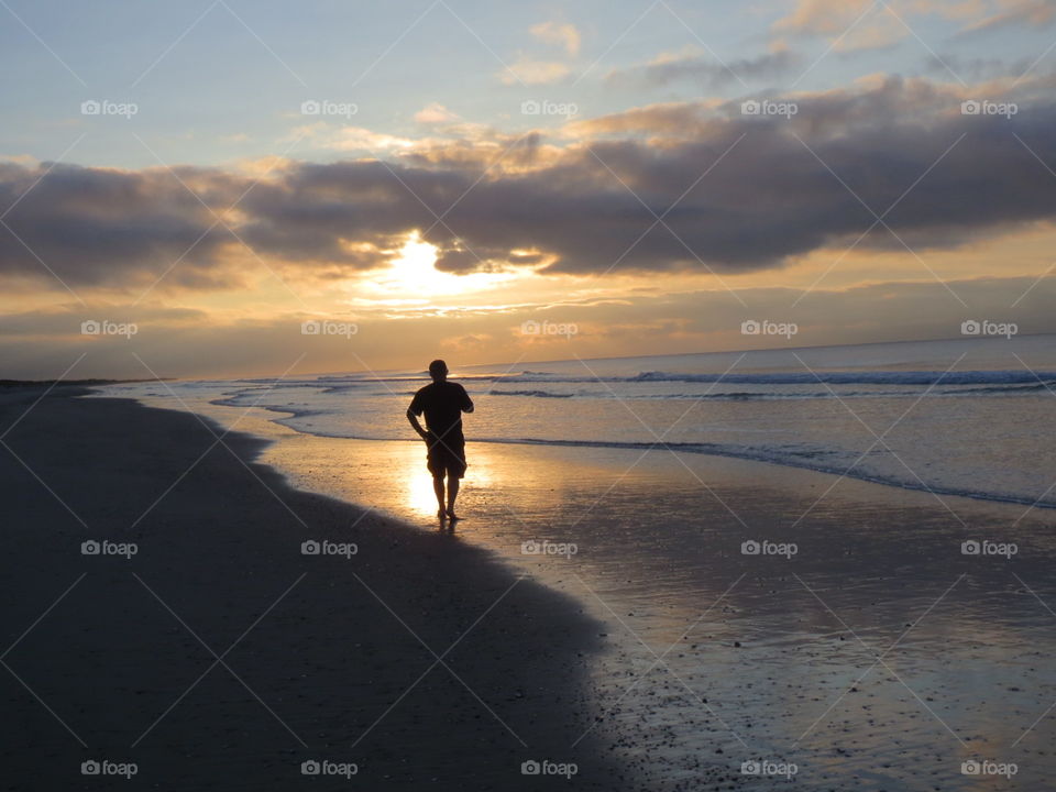 The Walking Man. The Walking Man on the beach