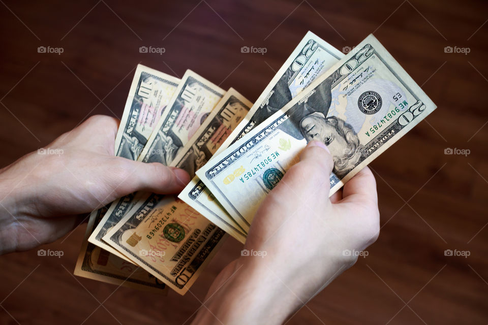 dollars in hands