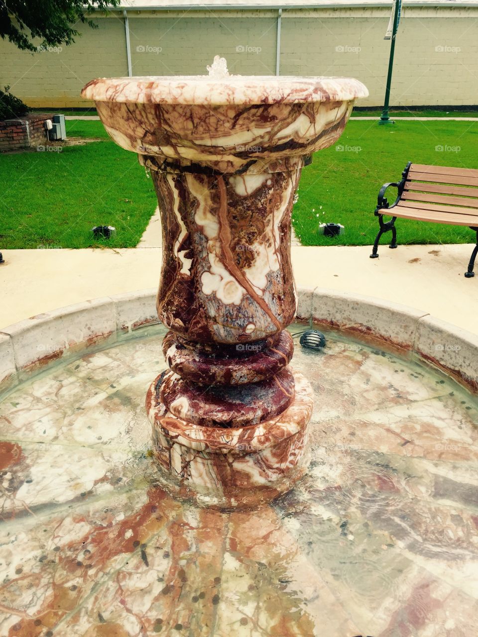 Water fountain in a park in summer.