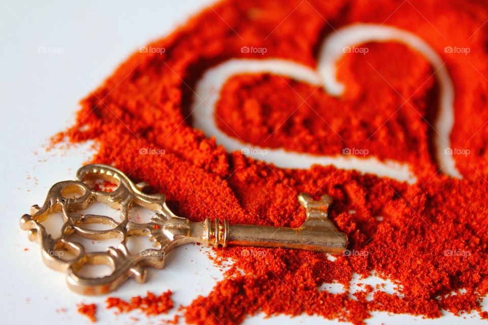 Key with heart shape paprika powder