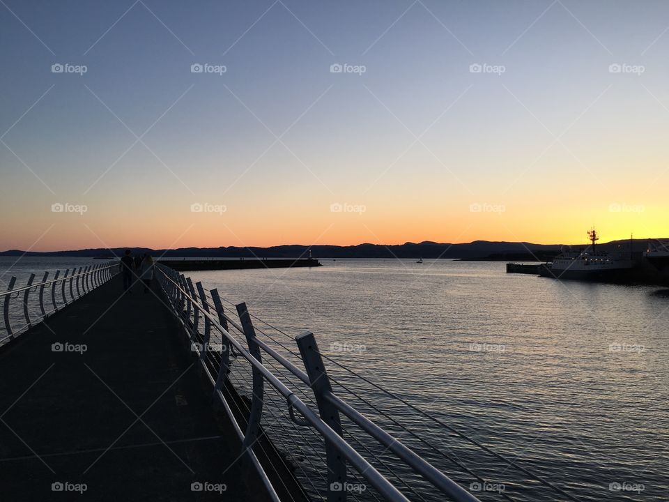 People walking on the pier