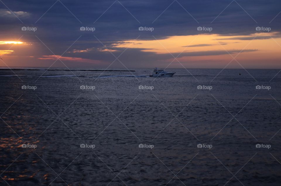 A beautiful sunrise off the horizon of the Absecon bay in Atlantic city lights up the morning sky.