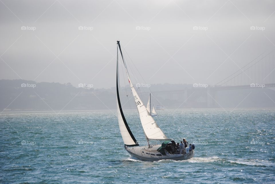 A foggy day will not stop these recreational sailers