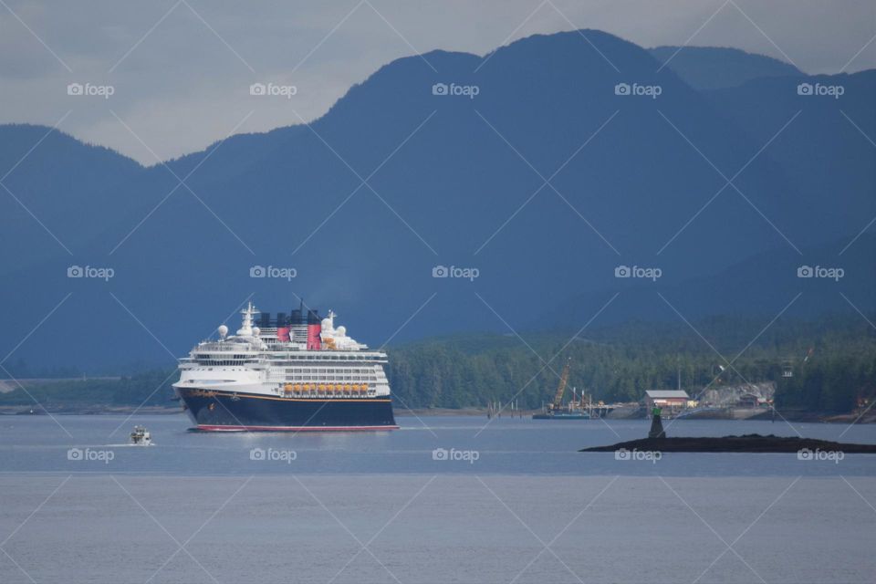 A cruise ship leaves an Alaskan port