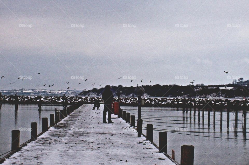 people at the pier in winter