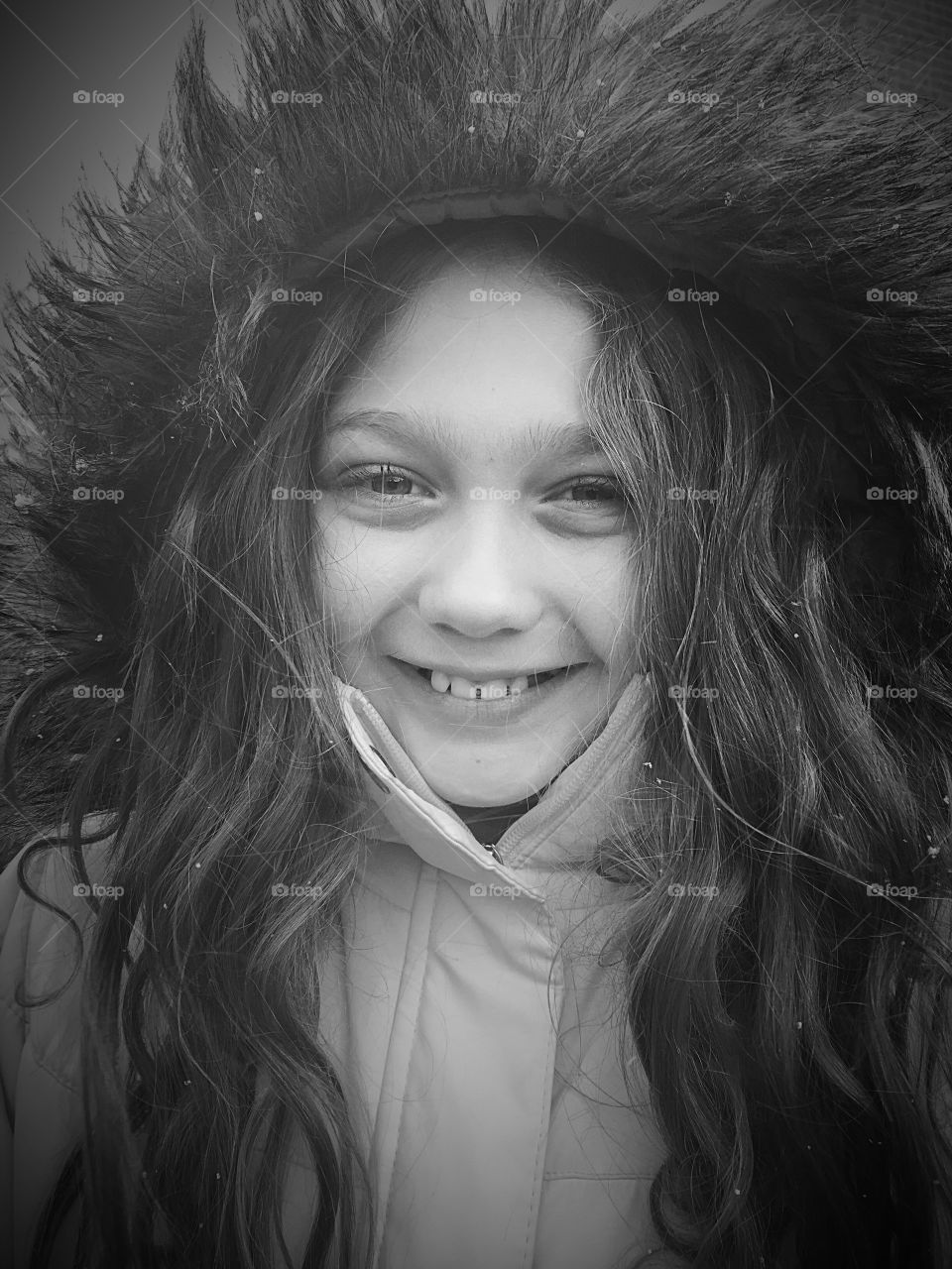 Portrait of a girl wearing furry hat