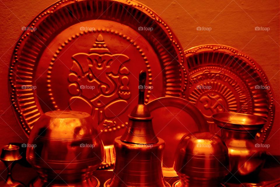 Copper articles at devotional place.