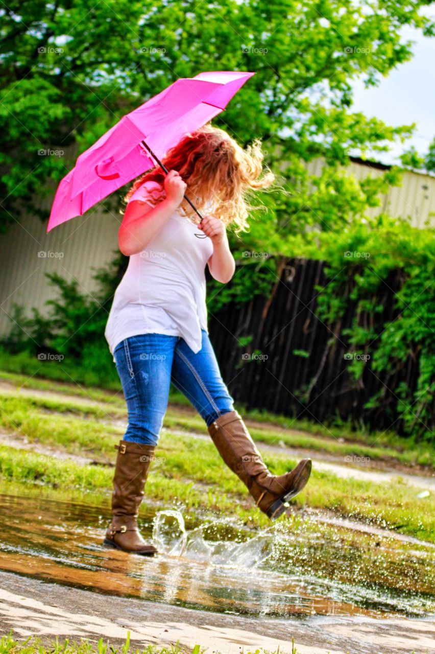 Playing in the rain. I took this photo of a friend playing in the rain.