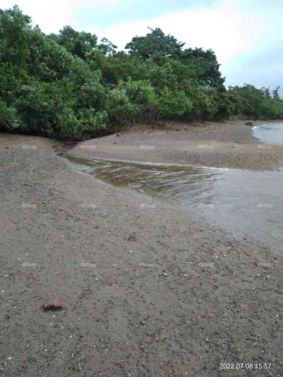 Thus stream appears when the tide is low at the Aroma coast of Papua New Guinea
