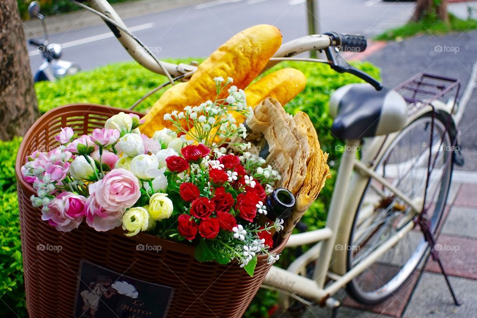 Flowers in the basket of a bike