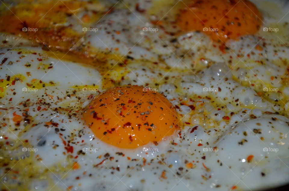 this photo makes you hungry because it represents fried eggs with its bright orange color and spices