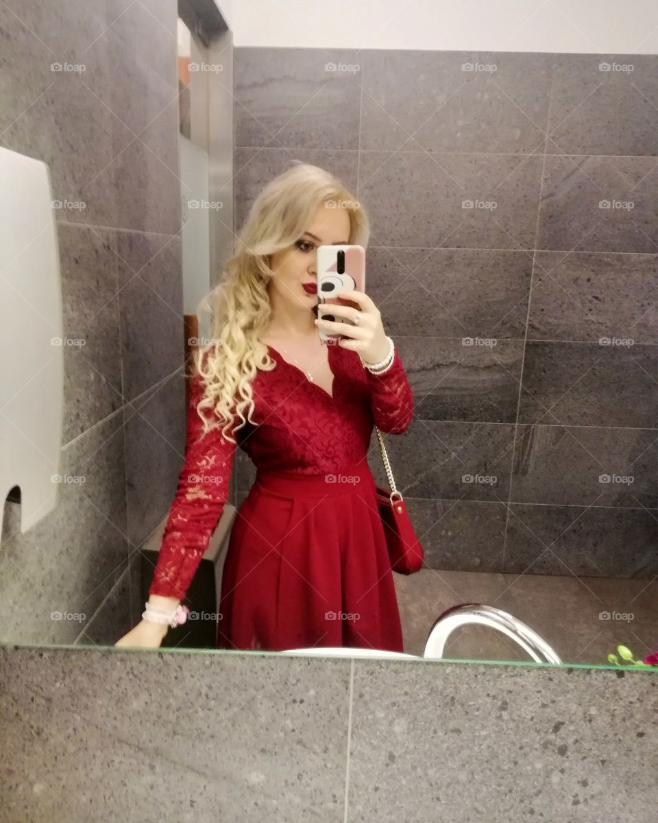 Glam with long blonde hair and red dress