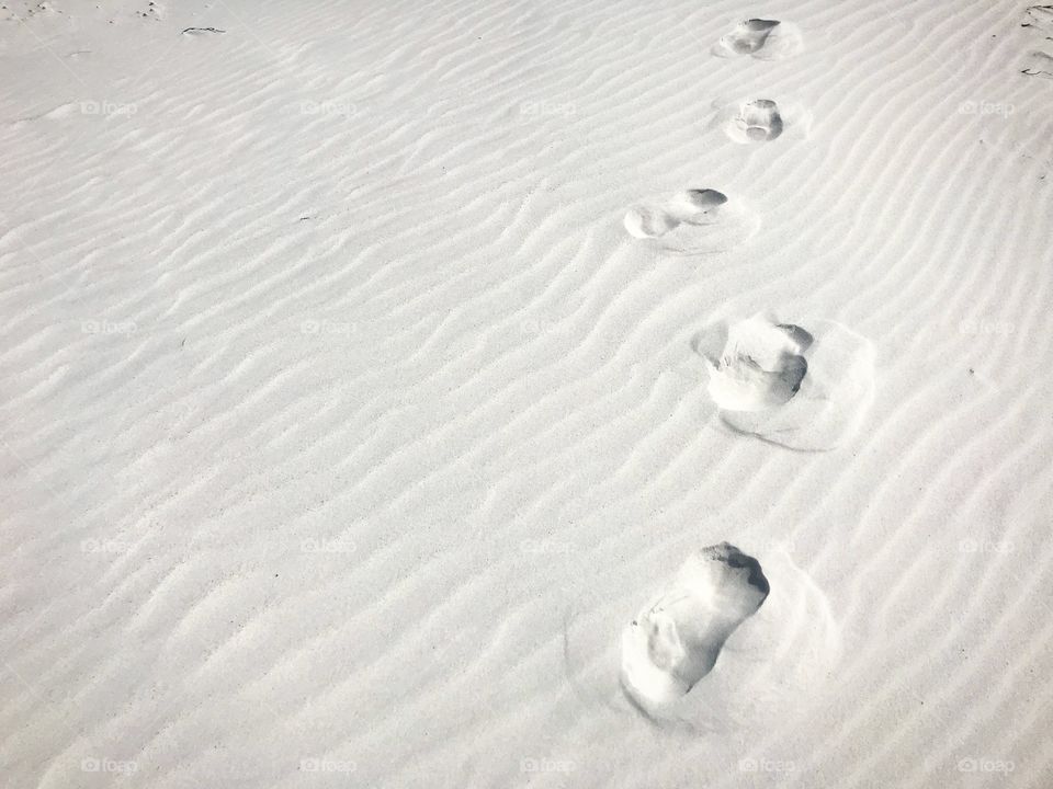 Footsteps in white sands of Florida