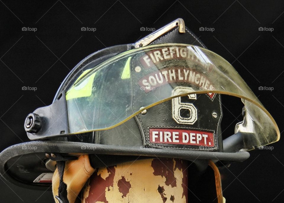 Fearless. Helmet put down while firefighter rested 