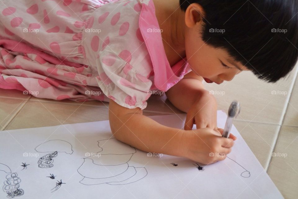 Little girl doodling