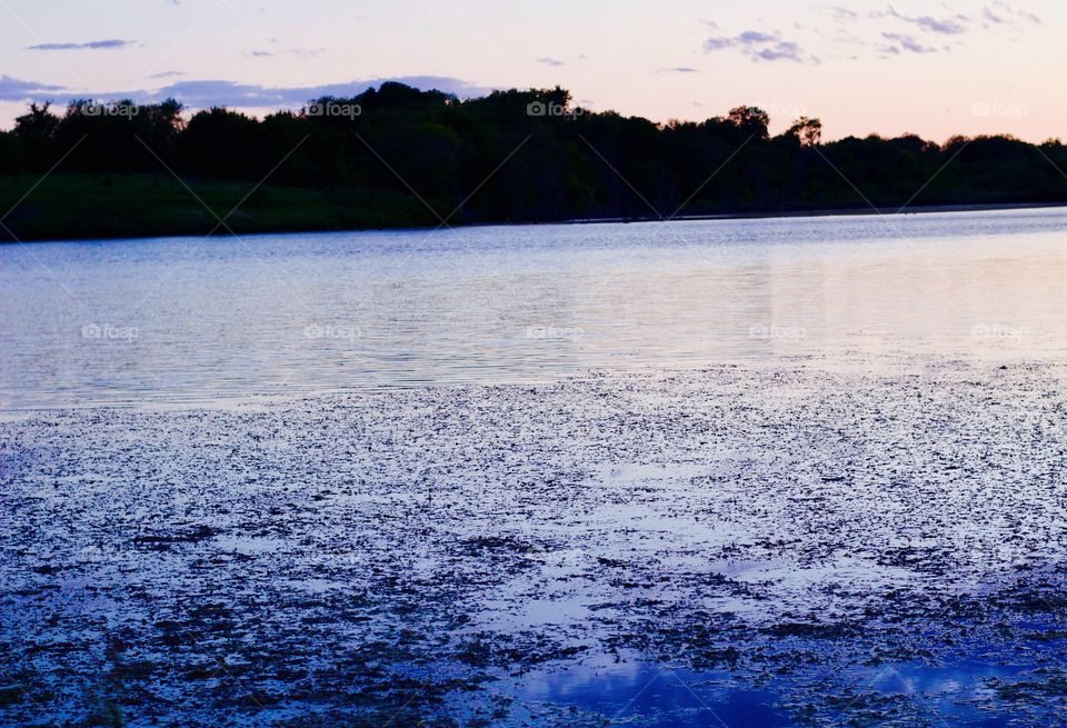 Water reflecting sky at twilight