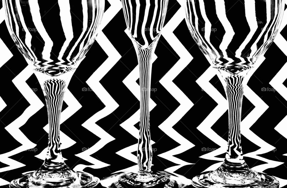 Abstract black and white wine glasses against a black and white background 