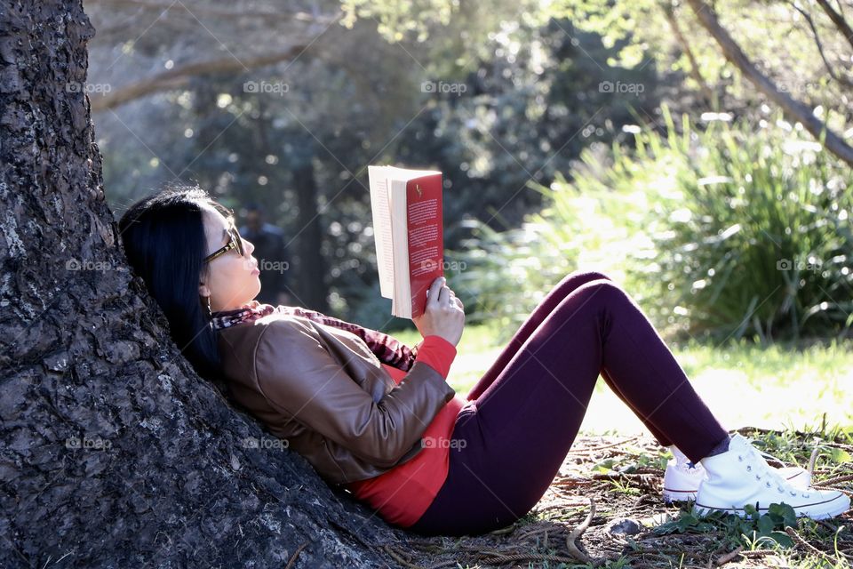 One of my favourite hobby is to read during my spare time under the trees.