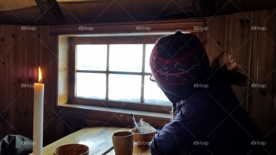 In winter cabin with candle