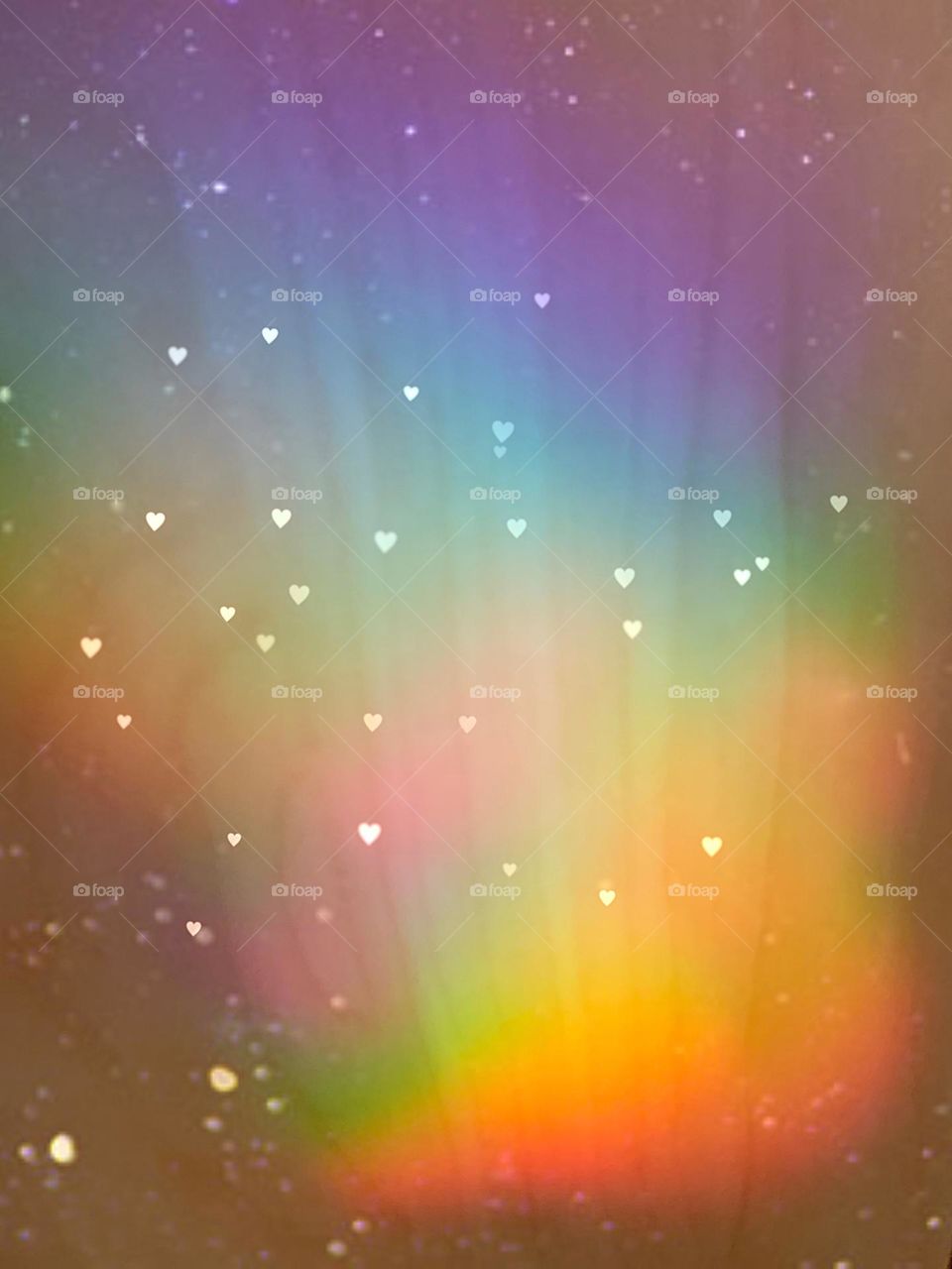 Rainbow background with tiny hearts.