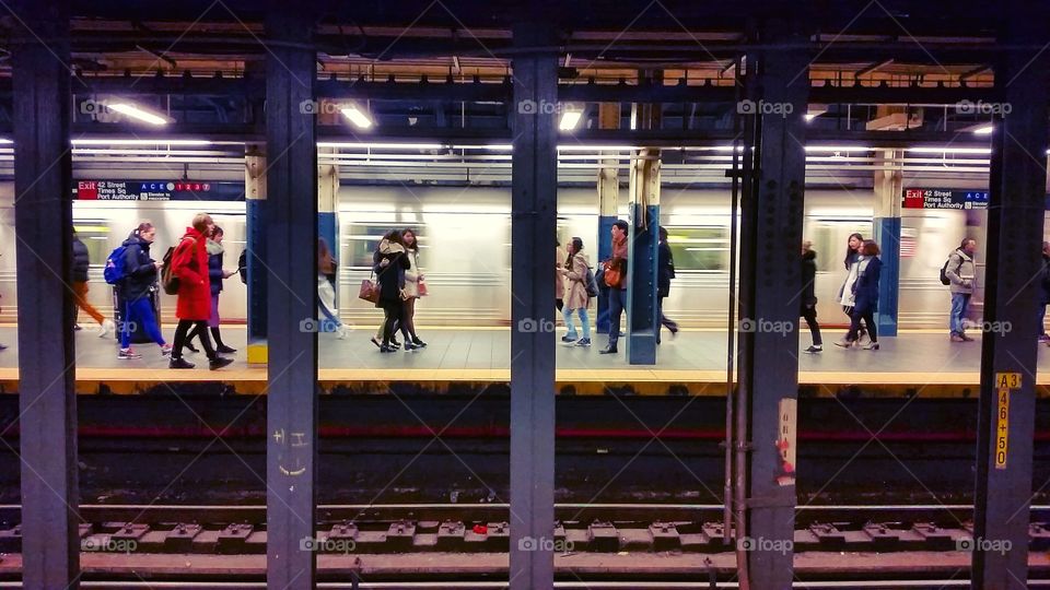 people in the subway walking