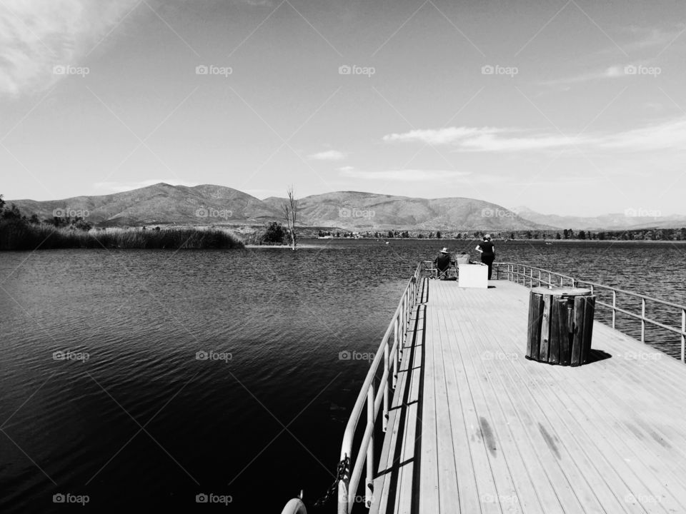 Black and white view of bridge over the lake
