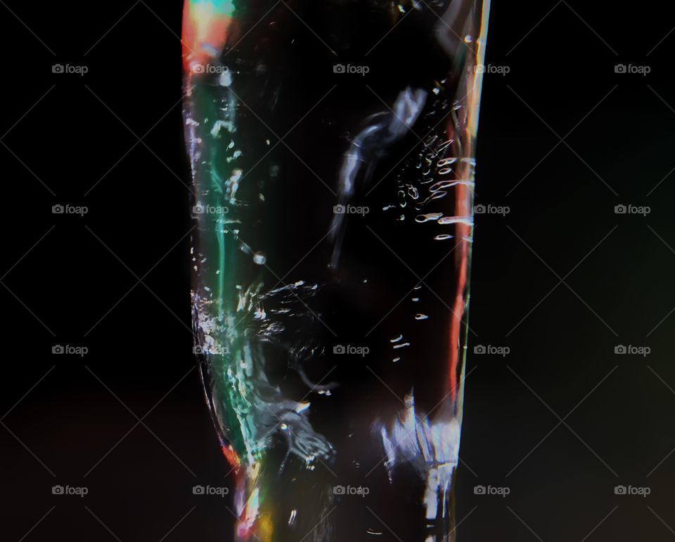 Amazingly textured ice with different colors of light coming through