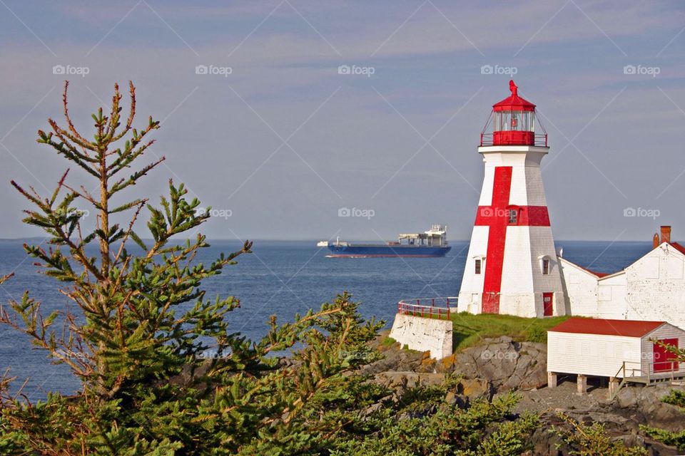 Painted light house near sea