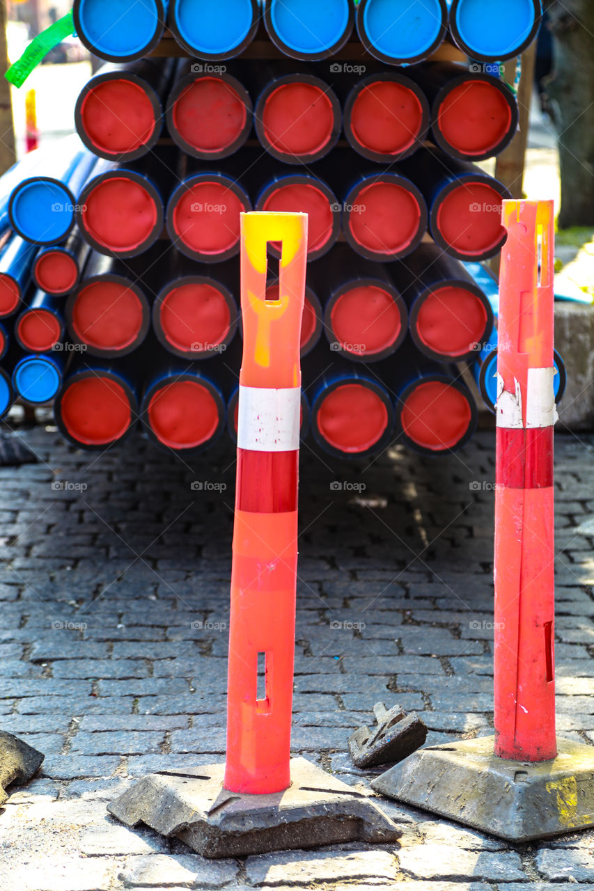 Street view from where they were standing outdoors with a car full of pipelines 