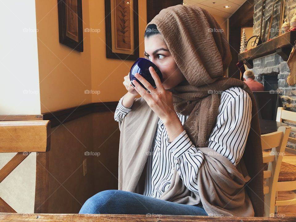 enjoying a cup of coffee on a cold day
