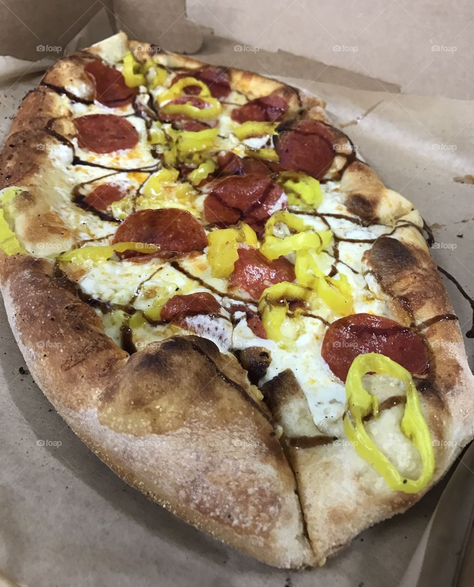 This is a unique combo for a pizza but flippin' delicious. Pepperoni, banana peppers, oil and garlic with mozzarella and balsamic glaze drizzle. Yumm! 