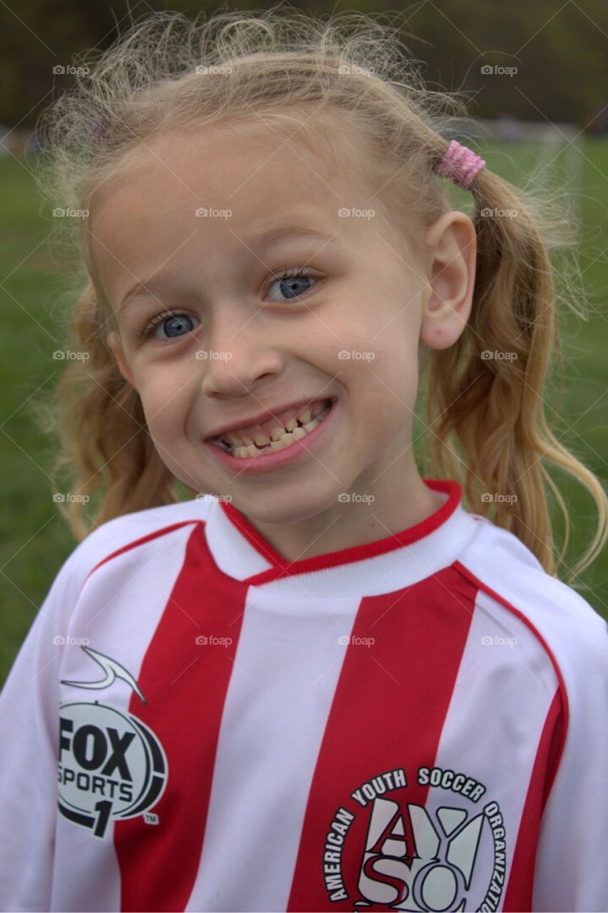 Closeup portrait of my happy little soccer player. 