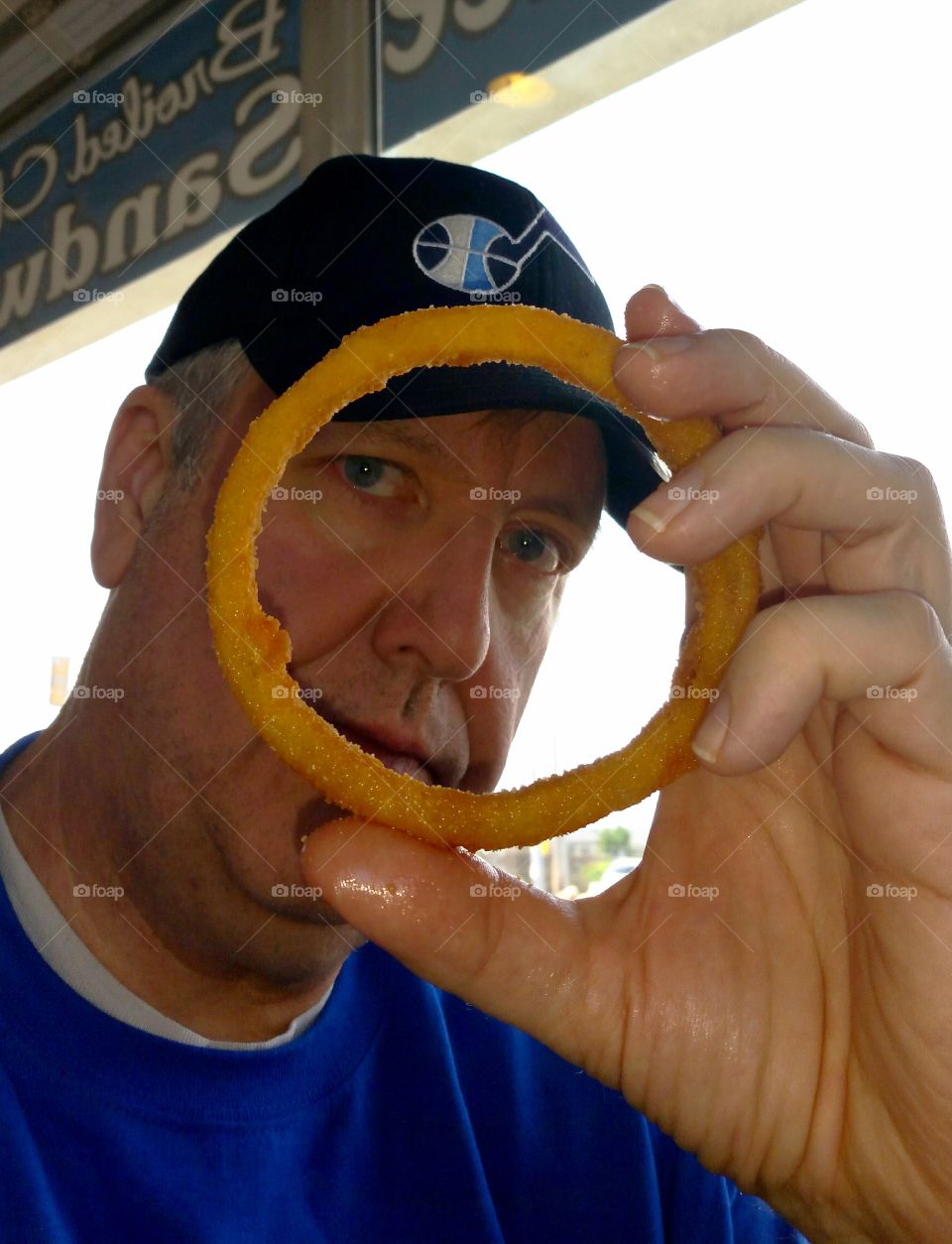 man with giant onion ring