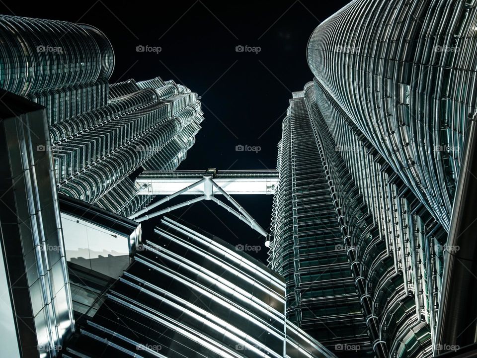Stainless steel facade of the Petronas Towers at night