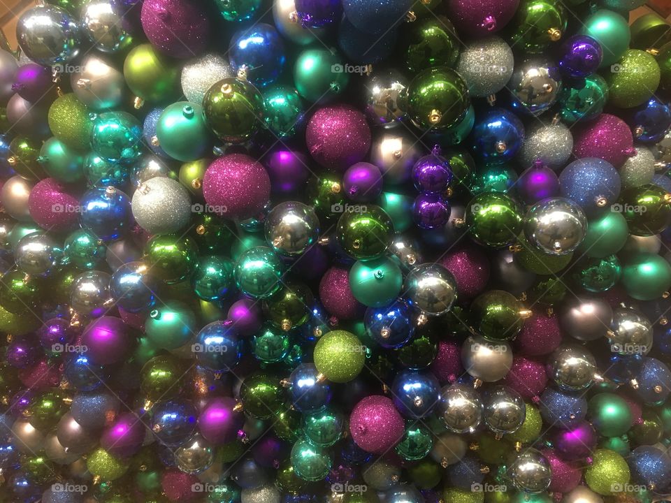 Decorative metallic coloured baubles for Christmas at Westfield Shopping Centre, West London.