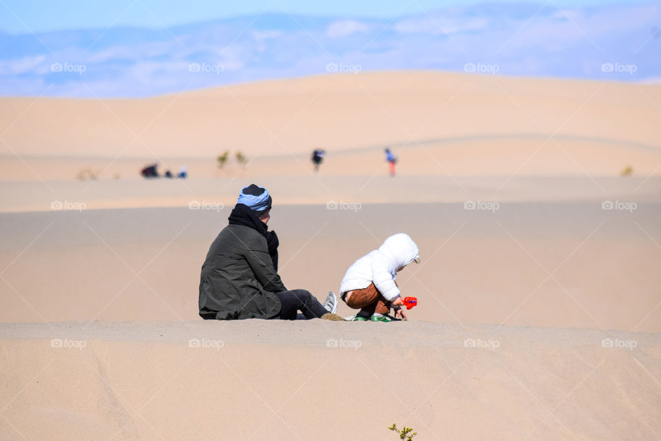 Enjoying the day with family on sand dunes