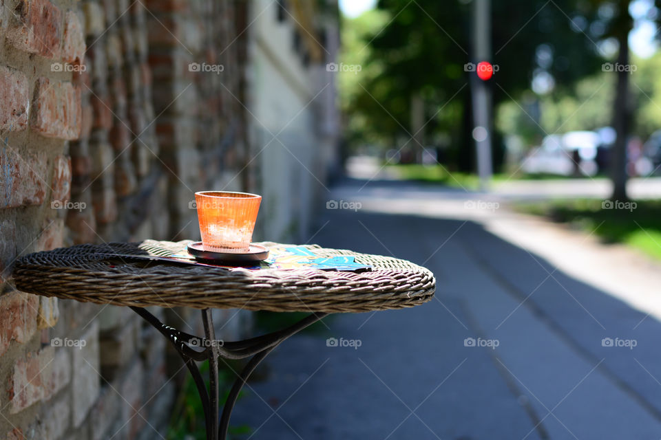 Drinking glass on table in street restaurant