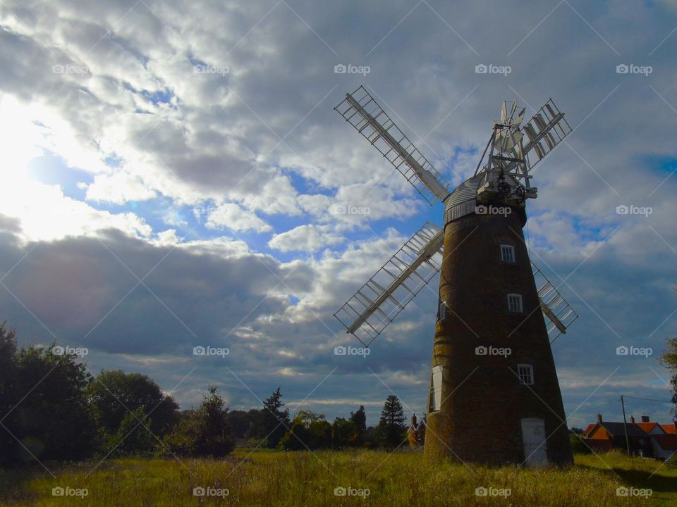 Billingford windmill, back view, beautiful sky and sun rays, Norfolk, UK