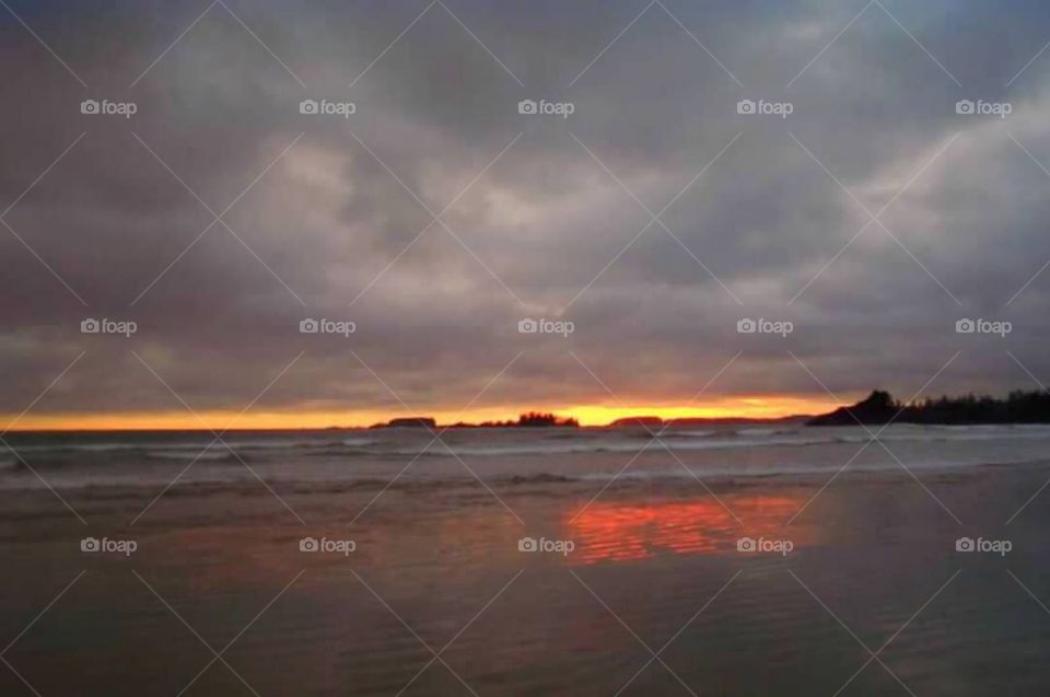 Sunset on a beach during a storm 