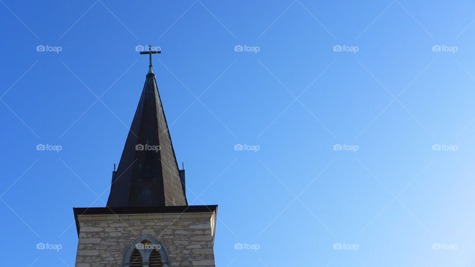 Church bell tower and cross