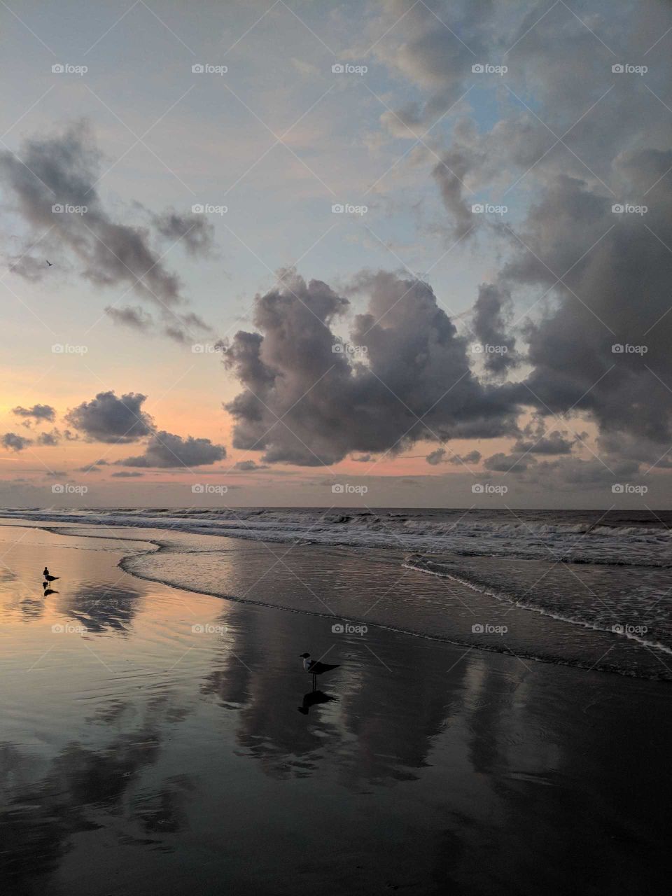 A picture of sunrise and clouds moving in at Folly Beach, SC